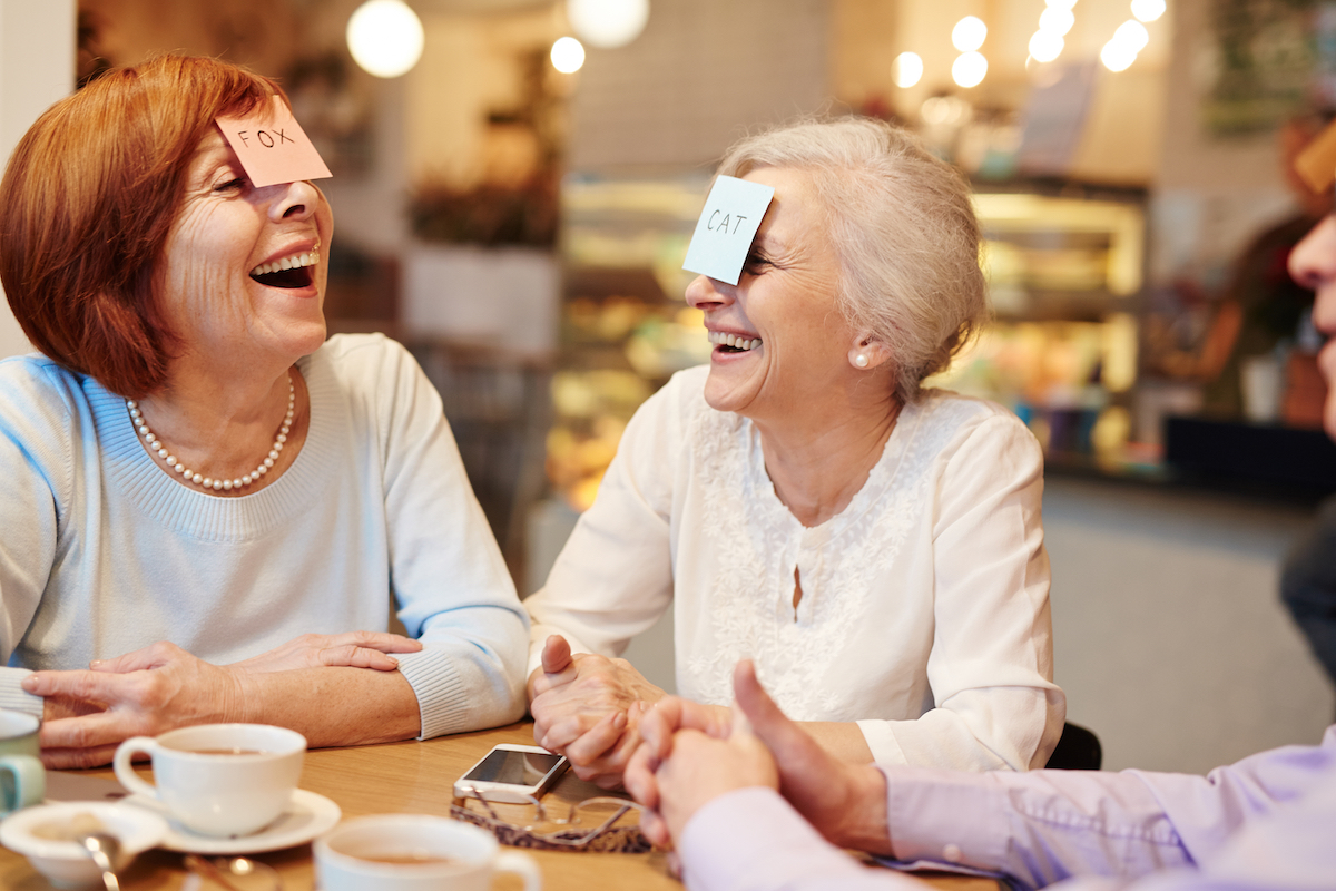 Senior Women Laughing and Playing Game_Vivage